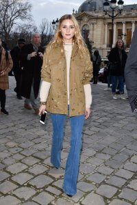 Olivia Palermo is wearing a pair of flared jeans, which are the trend for spring. 