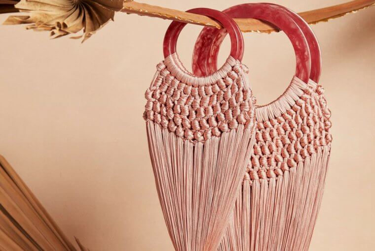 The bag of the season is made of bamboo and fishnet and of course comes by Cult Gaia.