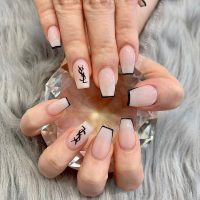 On the verge of kitsch or proof of exquisite taste a nail art with a luxury brand logo is the latest trend in nails. Love it hate it, they're here and we offer few ideas.